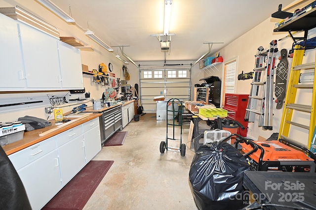 6302 Dwayne Starnes Dr, Hickory, NC 28602 - garage featuring a workshop area