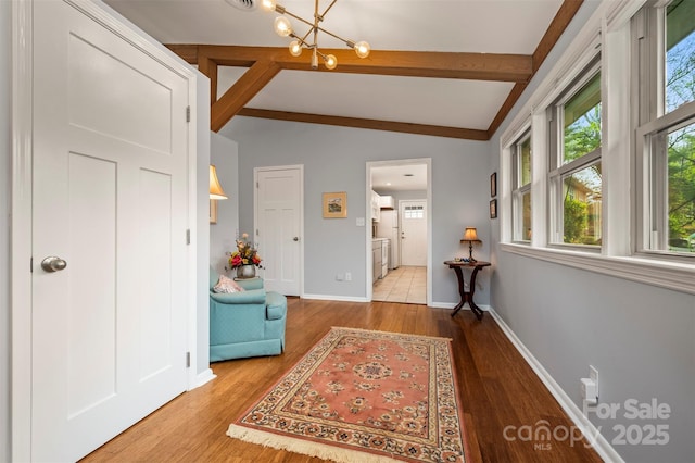 44 Jervey Rd Unit 3A, Tryon, NC 28782 - foyer with a chandelier, plenty of natural light, wood finished floors, and baseboards