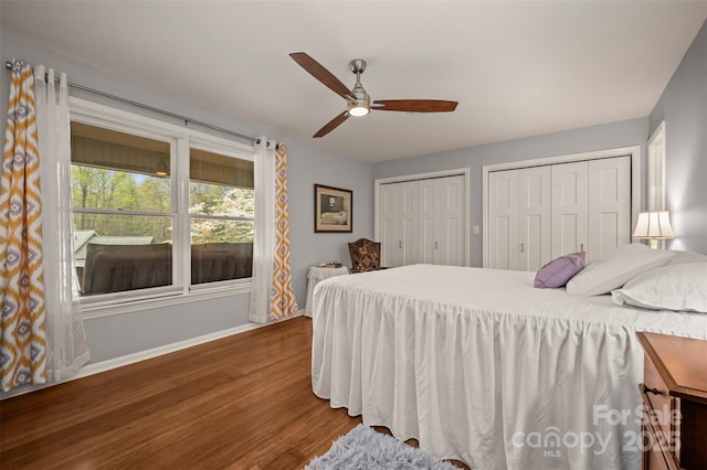 44 Jervey Rd Unit 3A, Tryon, NC 28782 - bedroom featuring wood finished floors, baseboards, multiple closets, and ceiling fan