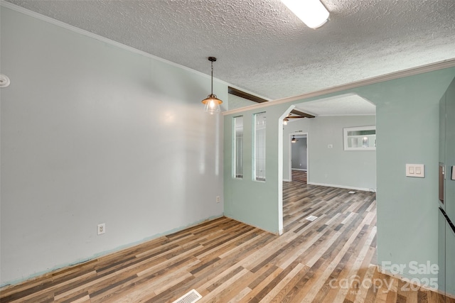 284 Cedar Grove Rd, Clover, SC 29710 - spare room with a textured ceiling, arched walkways, wood finished floors, and crown molding