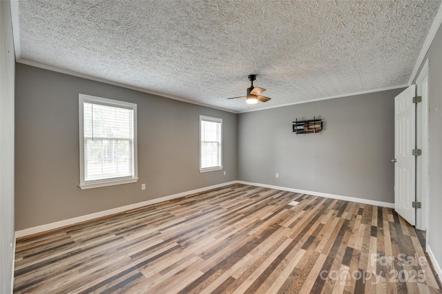 284 Cedar Grove Rd, Clover, SC 29710 - empty room with wood finished floors, crown molding, a ceiling fan, baseboards, and a textured ceiling