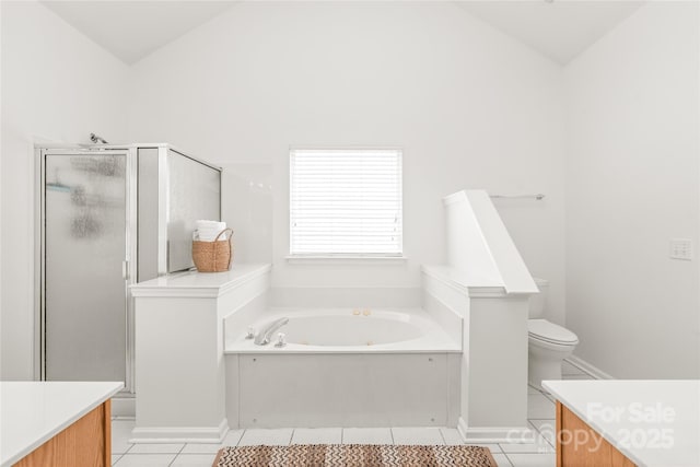 502 Roxanne Ct NW, Concord, NC 28027 - full bath featuring a bath, vanity, tile patterned floors, a shower stall, and vaulted ceiling
