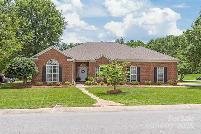 502 Roxanne Ct NW, Concord, NC 28027 - view of front of home with a front yard, brick siding, and a shingled roof