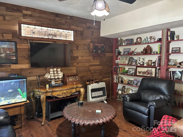 76 Six Springs Rd, Spruce Pine, NC 28777 - living area with wood walls, wood finished floors, and a ceiling fan