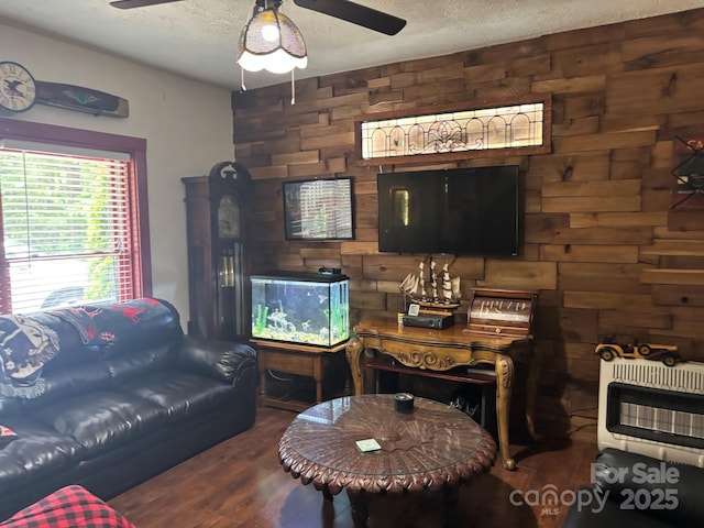 76 Six Springs Rd, Spruce Pine, NC 28777 - living room with ceiling fan, wood finished floors, heating unit, and a textured ceiling