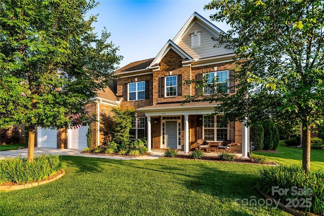 159 Holly Ridge Dr, Mooresville, NC 28115 - view of front of home with covered porch, brick siding, driveway, and a front yard