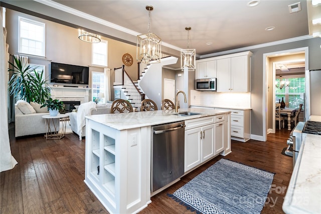 159 Holly Ridge Dr, Mooresville, NC 28115 - kitchen featuring appliances with stainless steel finishes, a sink, white cabinets, a kitchen island with sink, and a chandelier