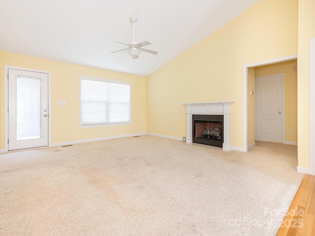 1271 Applewood Ln, York, SC 29745 - unfurnished living room featuring ceiling fan, vaulted ceiling, a fireplace, baseboards, and carpet