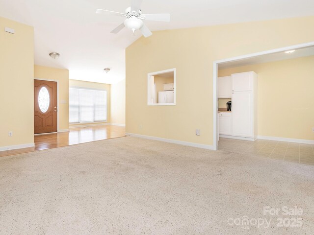 1271 Applewood Ln, York, SC 29745 - unfurnished living room featuring a ceiling fan, light colored carpet, and baseboards