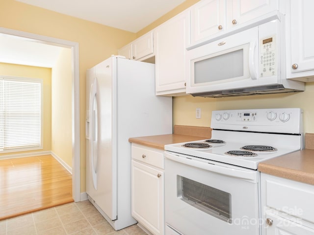 1271 Applewood Ln, York, SC 29745 - kitchen with white appliances, white cabinets, light countertops, and baseboards