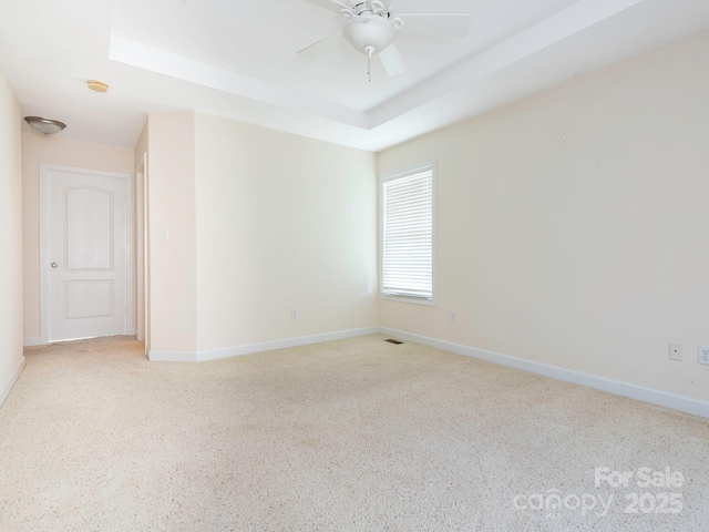 1271 Applewood Ln, York, SC 29745 - unfurnished room featuring a raised ceiling, baseboards, a smoke detector, ceiling fan, and carpet flooring
