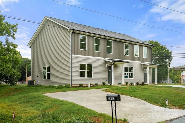 1600/1602 Bluff St, Albemarle, NC 28001 - view of front of property featuring cooling unit, a front lawn, and a shingled roof