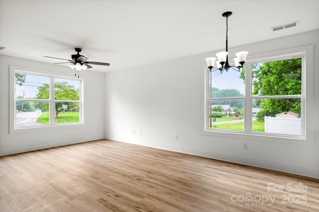 1600/1602 Bluff St, Albemarle, NC 28001 - unfurnished room with plenty of natural light, a chandelier, and light wood-type flooring
