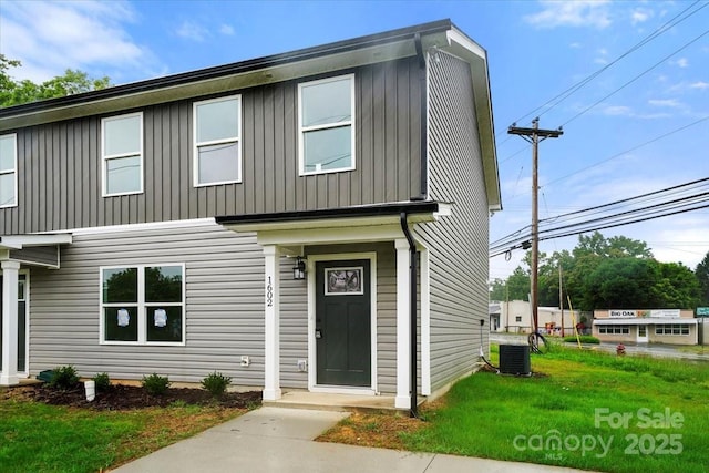 1600/1602 Bluff St, Albemarle, NC 28001 - view of front facade featuring central AC unit, board and batten siding, and a front lawn