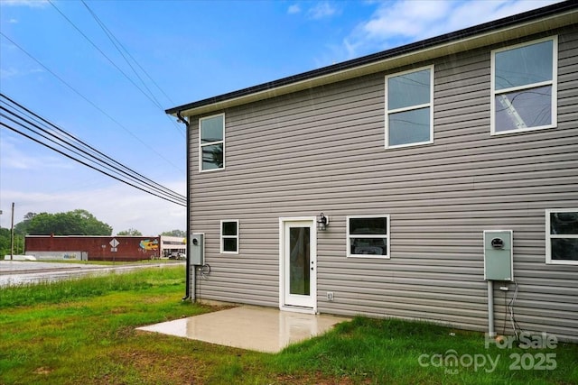 1600/1602 Bluff St, Albemarle, NC 28001 - rear view of house with a patio and a lawn