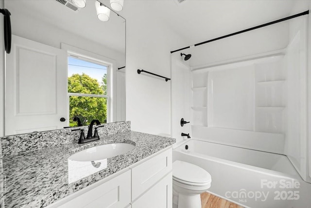 1600/1602 Bluff St, Albemarle, NC 28001 - full bath featuring vanity, toilet, bathing tub / shower combination, and wood finished floors