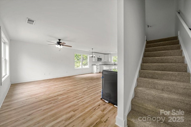 1600/1602 Bluff St, Albemarle, NC 28001 - stairs with a ceiling fan, wood finished floors, and baseboards