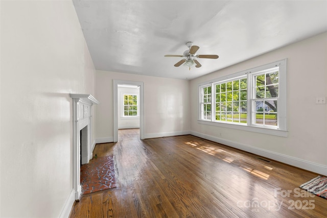 505 Franklin Ave, Shelby, NC 28150 - unfurnished living room with baseboards, a ceiling fan, wood finished floors, and a fireplace