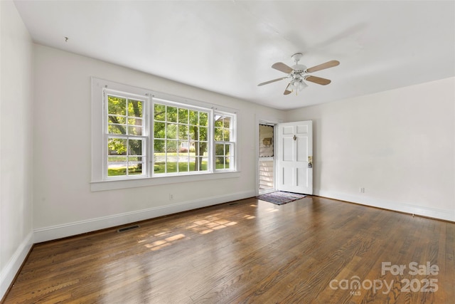505 Franklin Ave, Shelby, NC 28150 - spare room featuring baseboards, a ceiling fan, and wood finished floors