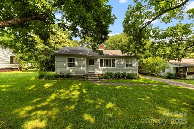 505 Franklin Ave, Shelby, NC 28150 - view of front of house with a front lawn and a chimney
