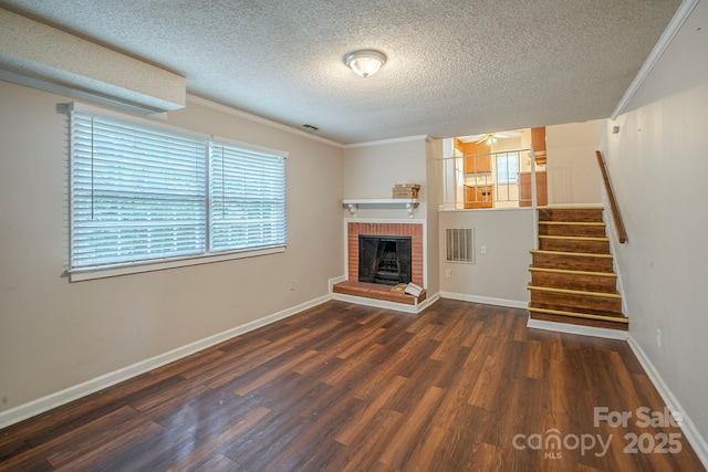 7320 Ritter Dr, Charlotte, NC 28270 - unfurnished living room with ornamental molding, wood finished floors, ceiling fan, a textured ceiling, and a fireplace
