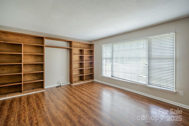 7320 Ritter Dr, Charlotte, NC 28270 - empty room featuring wood finished floors and a textured ceiling