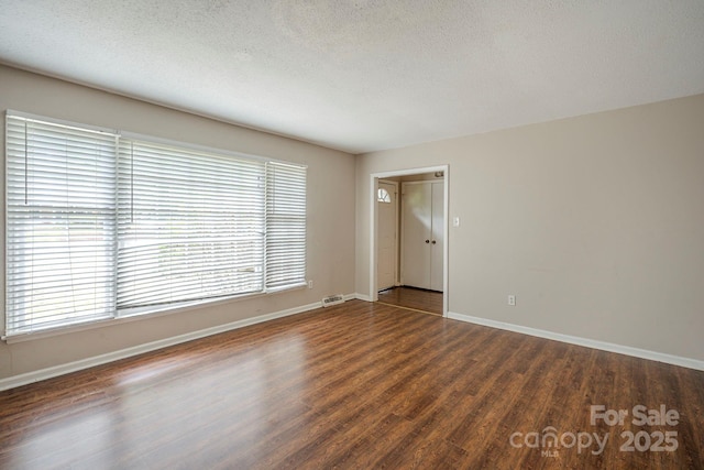7320 Ritter Dr, Charlotte, NC 28270 - spare room featuring wood finished floors and a textured ceiling