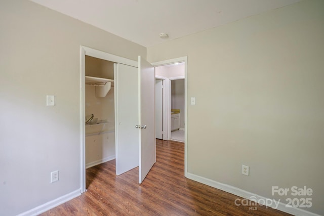 7320 Ritter Dr, Charlotte, NC 28270 - unfurnished bedroom with wood finished floors and a closet
