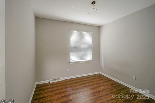 7320 Ritter Dr, Charlotte, NC 28270 - empty room featuring dark wood-type flooring and baseboards