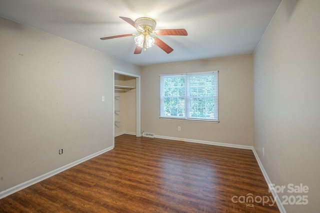 7320 Ritter Dr, Charlotte, NC 28270 - unfurnished bedroom with wood finished floors, a closet, and ceiling fan