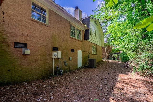7320 Ritter Dr, Charlotte, NC 28270 - view of side of property with a chimney and brick siding