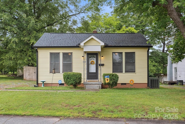 1425 3rd Street Pl NE, Hickory, NC 28601 - bungalow with central AC unit, crawl space, a front lawn, and roof with shingles