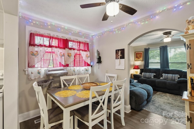 1425 3rd Street Pl NE, Hickory, NC 28601 - dining space with ceiling fan, a textured ceiling, arched walkways, baseboards, and wood finished floors