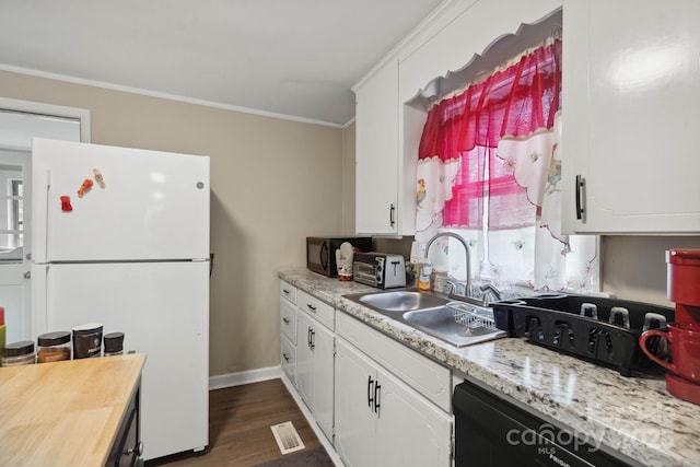 1425 3rd Street Pl NE, Hickory, NC 28601 - kitchen featuring freestanding refrigerator, a sink, crown molding, light countertops, and white cabinets