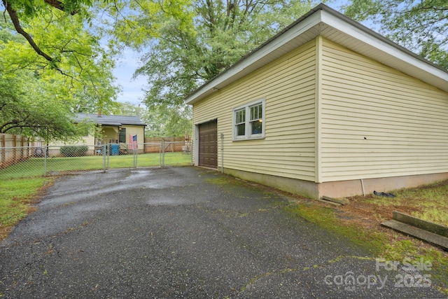 1425 3rd Street Pl NE, Hickory, NC 28601 - view of side of property featuring asphalt driveway and a gate