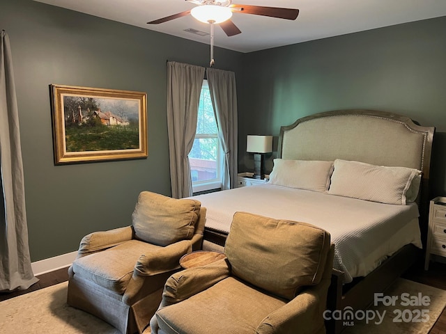 49 S Sundrops Trl, Cullowhee, NC 28723 - bedroom with wood finished floors, a ceiling fan, and baseboards