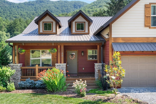 49 S Sundrops Trl, Cullowhee, NC 28723 - view of front of house featuring covered porch, a mountain view, a metal roof, and an attached garage