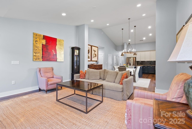 49 S Sundrops Trl, Cullowhee, NC 28723 - living room featuring wood finished floors, recessed lighting, high vaulted ceiling, and a chandelier
