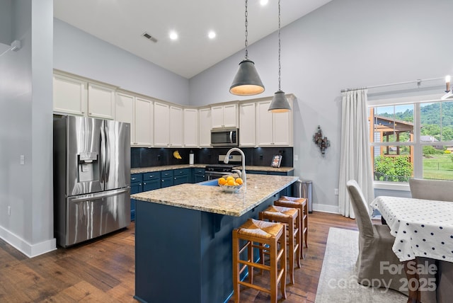 49 S Sundrops Trl, Cullowhee, NC 28723 - kitchen featuring appliances with stainless steel finishes, high vaulted ceiling, dark wood-style flooring, tasteful backsplash, and a kitchen island with sink