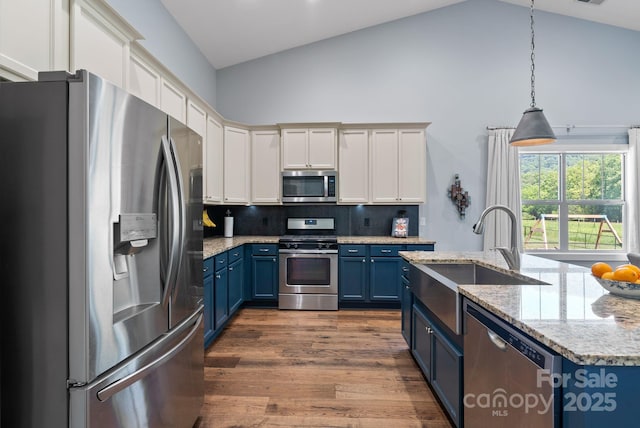 49 S Sundrops Trl, Cullowhee, NC 28723 - kitchen featuring stainless steel appliances, blue cabinets, backsplash, dark wood-style flooring, and hanging light fixtures