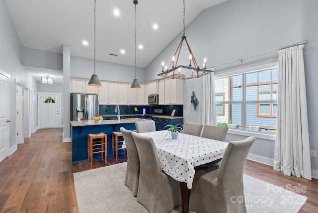 49 S Sundrops Trl, Cullowhee, NC 28723 - dining space featuring high vaulted ceiling, a chandelier, dark wood-type flooring, and recessed lighting