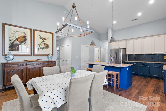 49 S Sundrops Trl, Cullowhee, NC 28723 - dining area featuring high vaulted ceiling, a chandelier, dark wood finished floors, and recessed lighting