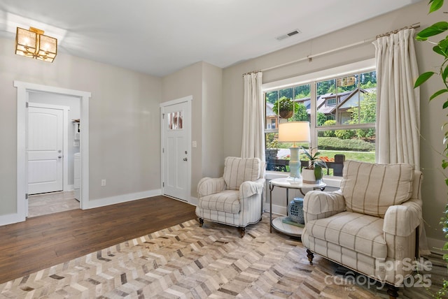 49 S Sundrops Trl, Cullowhee, NC 28723 - sitting room with wood finished floors and a chandelier