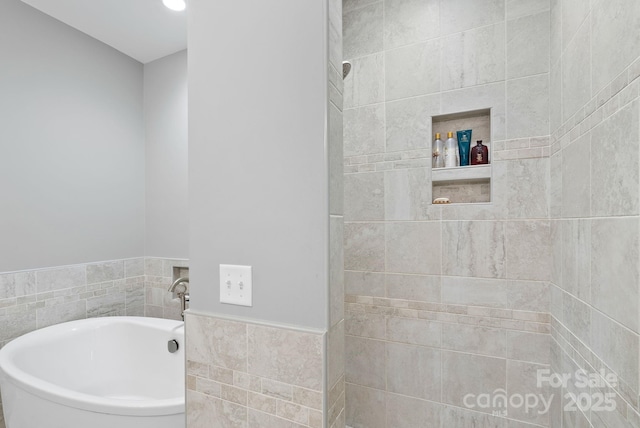 49 S Sundrops Trl, Cullowhee, NC 28723 - bathroom featuring a garden tub, tile walls, and wainscoting