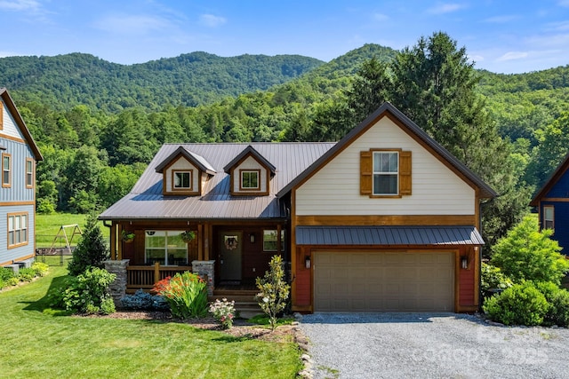 49 S Sundrops Trl, Cullowhee, NC 28723 - view of front of property featuring covered porch, a forest view, a mountain view, a front lawn, and an attached garage