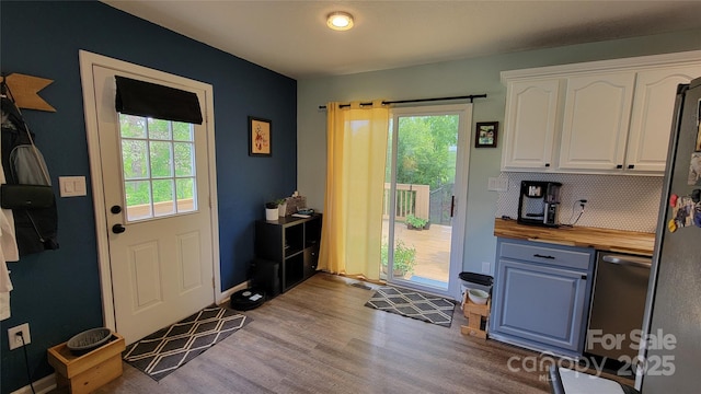 10 Haven Crest Ln, Fletcher, NC 28732 - doorway featuring healthy amount of natural light, wood finished floors, and baseboards