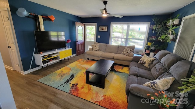 10 Haven Crest Ln, Fletcher, NC 28732 - living room featuring a ceiling fan, wood finished floors, and baseboards
