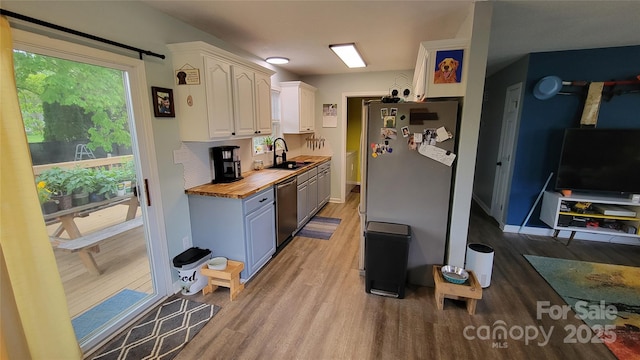 10 Haven Crest Ln, Fletcher, NC 28732 - kitchen with wood counters, light wood finished floors, white cabinetry, stainless steel appliances, and a sink
