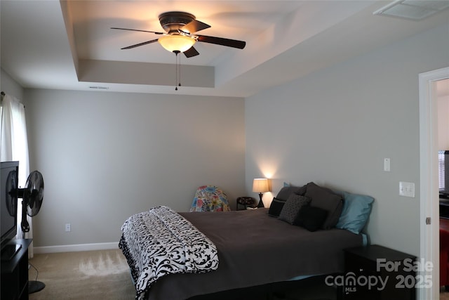 10726 Greenhead View Rd, Charlotte, NC 28262 - bedroom featuring a raised ceiling, light carpet, and ceiling fan