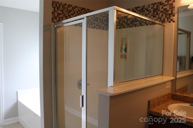 10726 Greenhead View Rd, Charlotte, NC 28262 - bathroom featuring a stall shower, vanity, and a garden tub